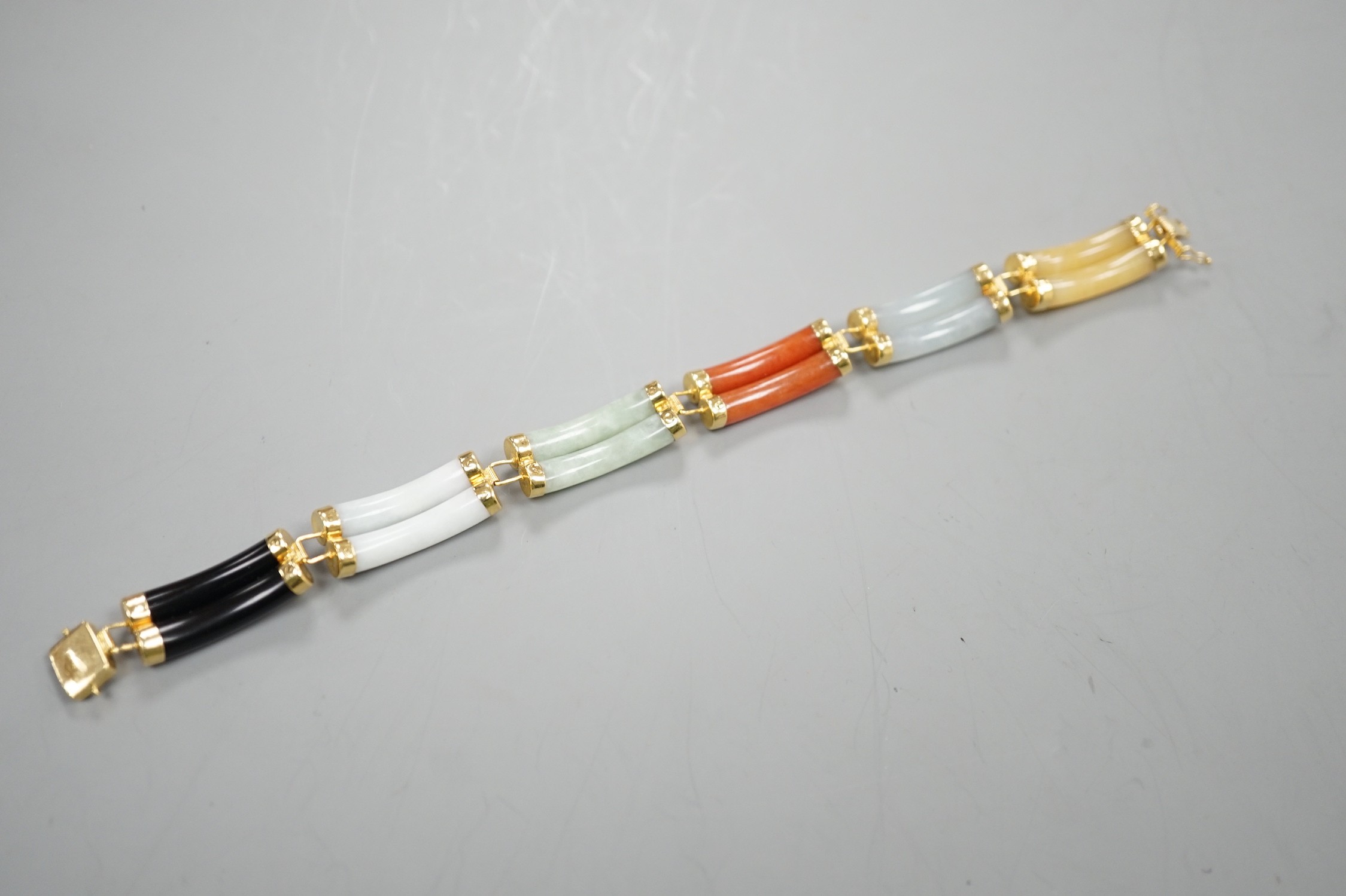 A Chinese 18k, black onyx and multi coloured jade set bracelet, 17.75cm, gross weight 20 grams.